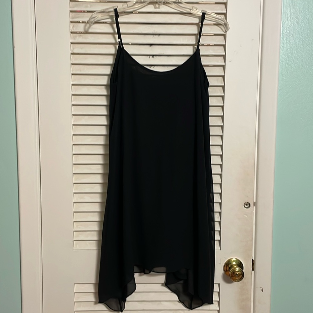 Spaghetti strap little black dress with handkerchief hem